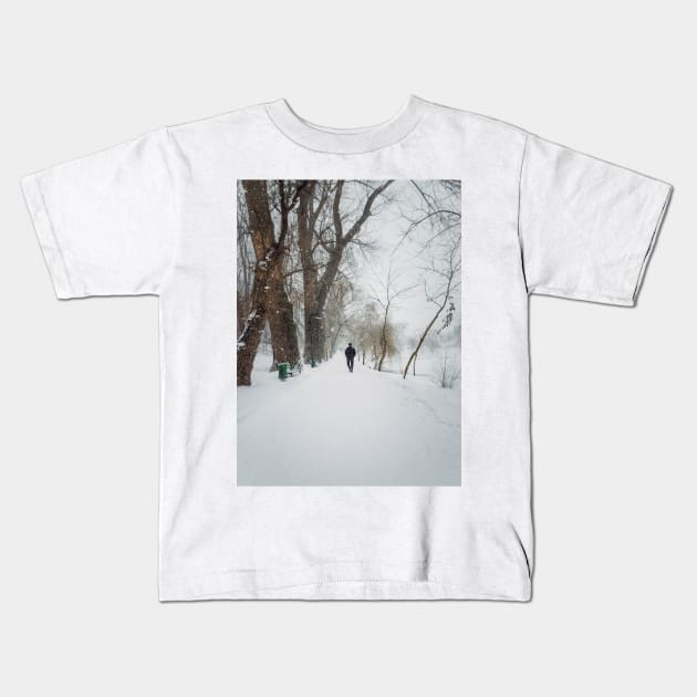 wandering the snowy park Kids T-Shirt by psychoshadow